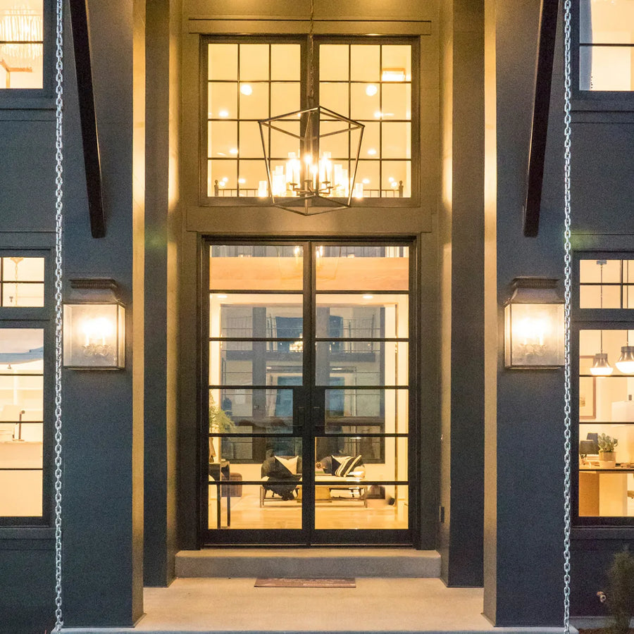 artisan-luxury-steel-double-entry-door-transom-glass-grid-design-grand-entrance-warm-lighting-aed-artisanentrydoors