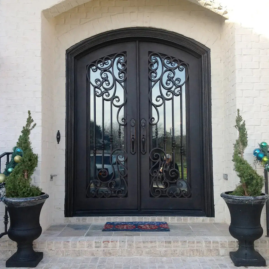 artisan-wrought-iron-double-entry-door-decorative-scrollwork-arched-top-clear-glass-aed-artisanentrydoors